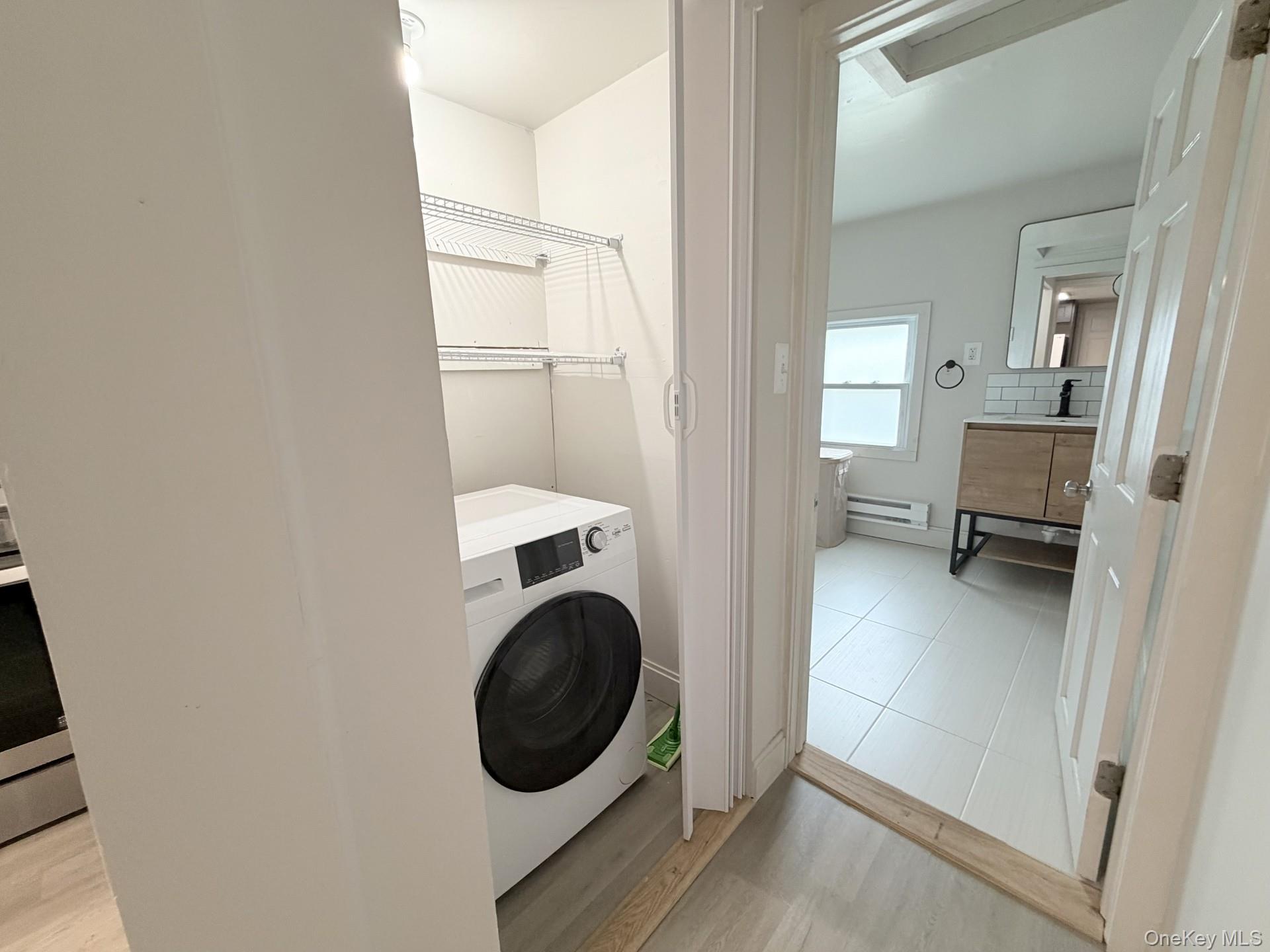 4 Lower Trinity Pass Road Pound Ridge, NY 10576 - Photo 22 of 29 a view of a kitchen with a washer and dryer