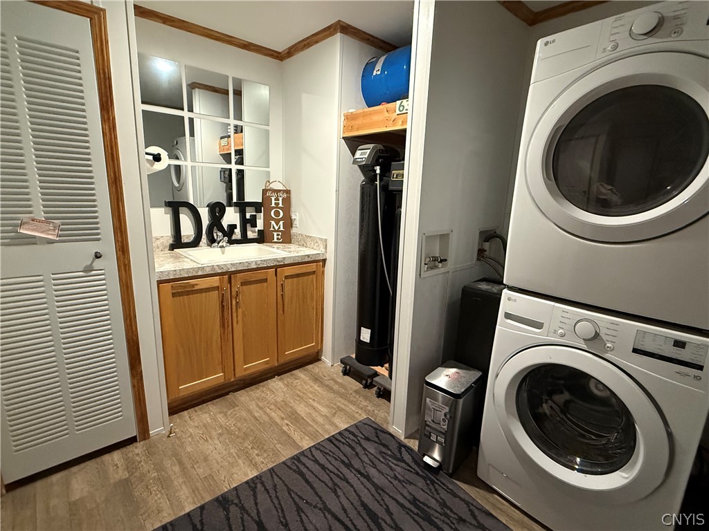 4909 Goff Road Smithfield, NY 13408 - Photo 26 of 27 1st floor laundry with sink, washer & dryer
