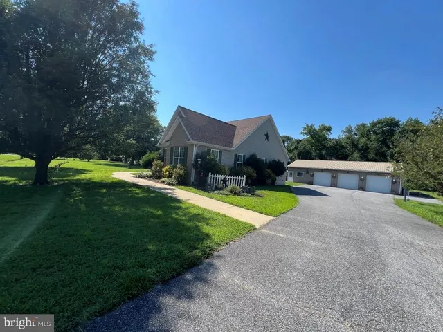 a view of house with outdoor space and yard