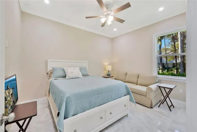 a bedroom with a bed and chair