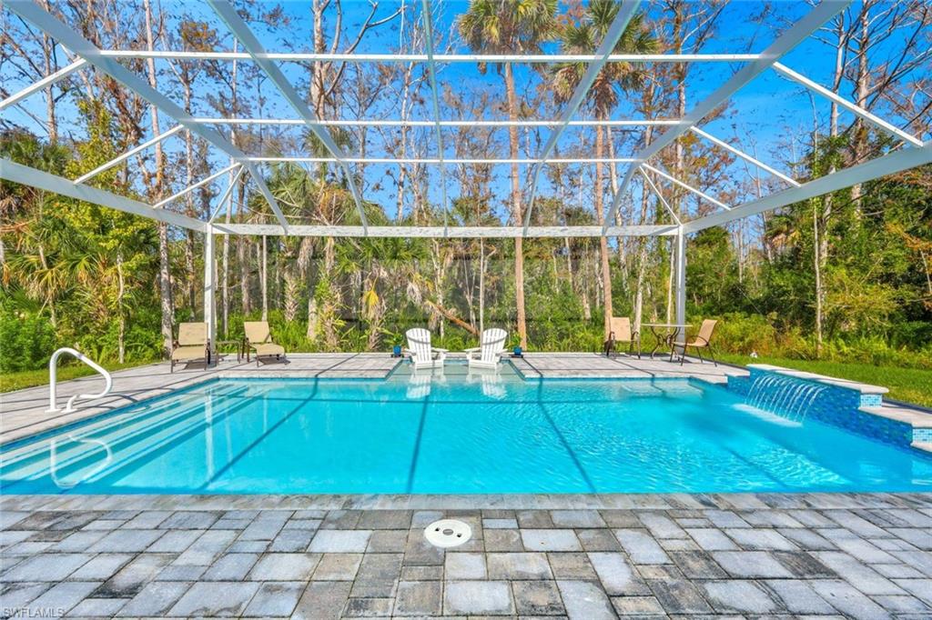 589 12th Avenue Northwest Naples, FL 34120 - Photo 25 of 28 a view of a house with a swimming pool