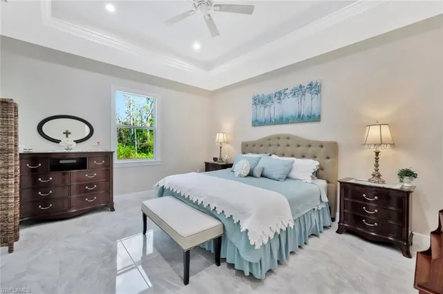 a bedroom with a bed and a table