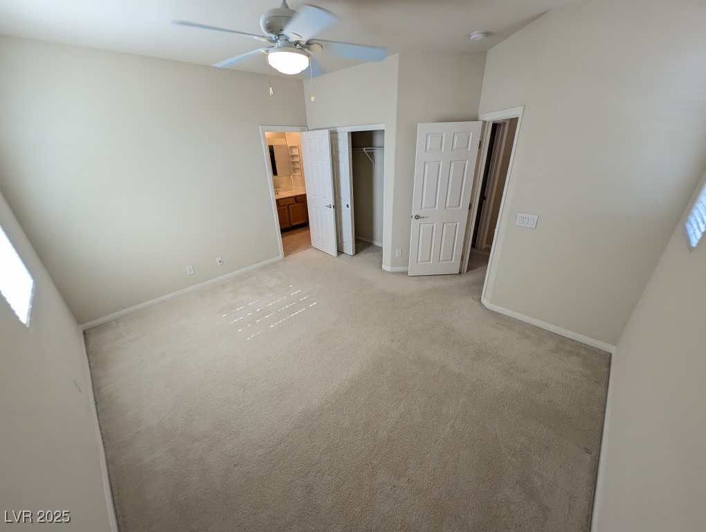 62 Augusta Course Avenue Las Vegas, NV 89148 - Photo 16 of 26 Unfurnished bedroom with carpet, connected bathroom, and ceiling fan