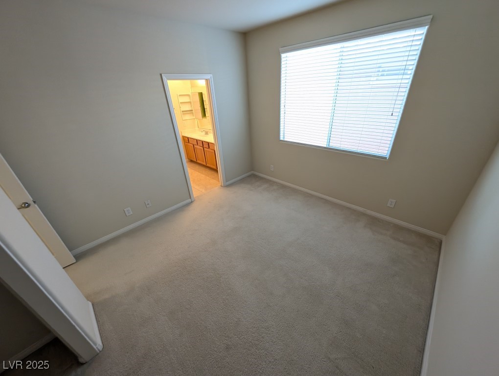 62 Augusta Course Avenue Las Vegas, NV 89148 - Photo 21 of 26 Unfurnished bedroom featuring carpet flooring and ensuite bathroom