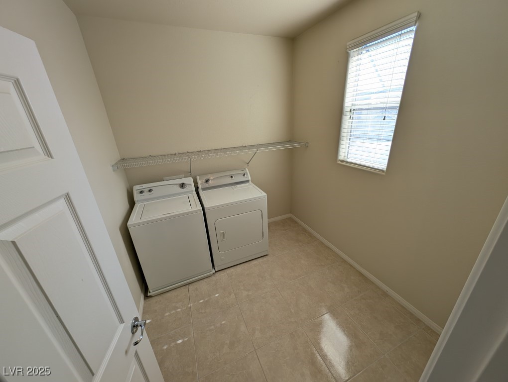 62 Augusta Course Avenue Las Vegas, NV 89148 - Photo 22 of 26 Laundry room featuring independent washer and dryer and light tile patterned flooring