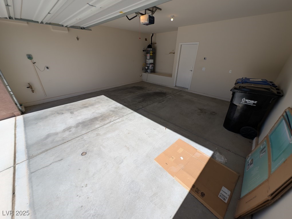 62 Augusta Course Avenue Las Vegas, NV 89148 - Photo 24 of 26 Garage with strapped water heater and a garage door opener