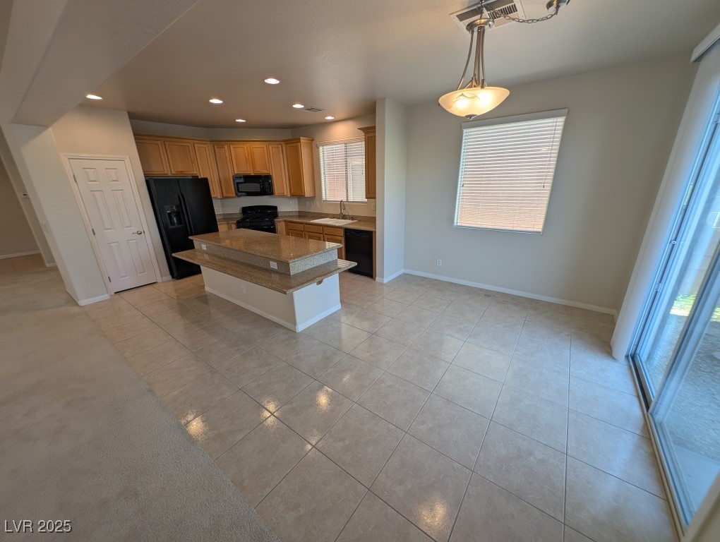 62 Augusta Course Avenue Las Vegas, NV 89148 - Photo 4 of 26 Kitchen featuring recessed lighting, black appliances, a kitchen island, decorative light fixtures, and light tile patterned flooring