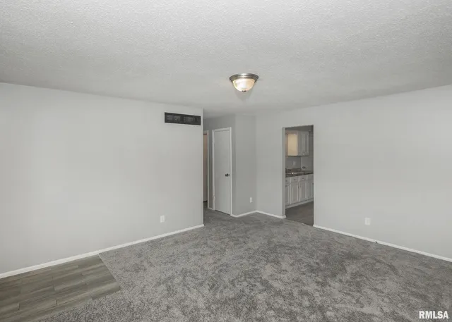 a white toilet sitting next to a white tub