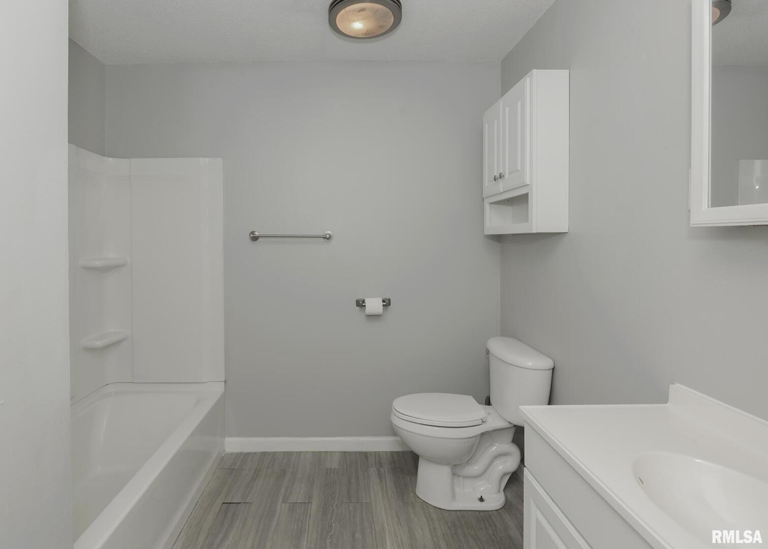 1310 Calvin Street Davenport, IA 52804 - Photo 17 of 39 a white toilet sitting next to a white tub