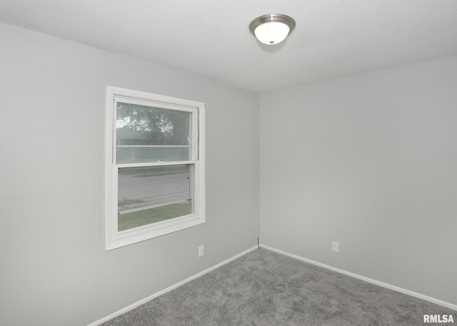 1310 Calvin Street Davenport, IA 52804 - Photo 21 of 39 an empty room with a window