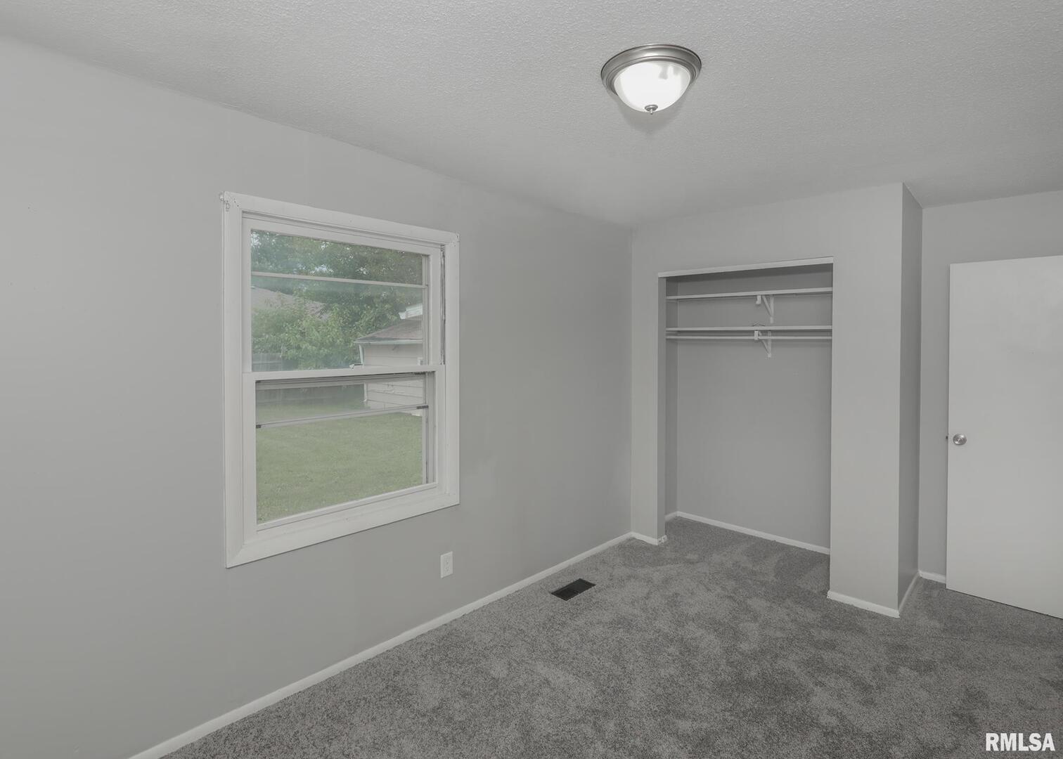 1310 Calvin Street Davenport, IA 52804 - Photo 26 of 39 an empty room with a window