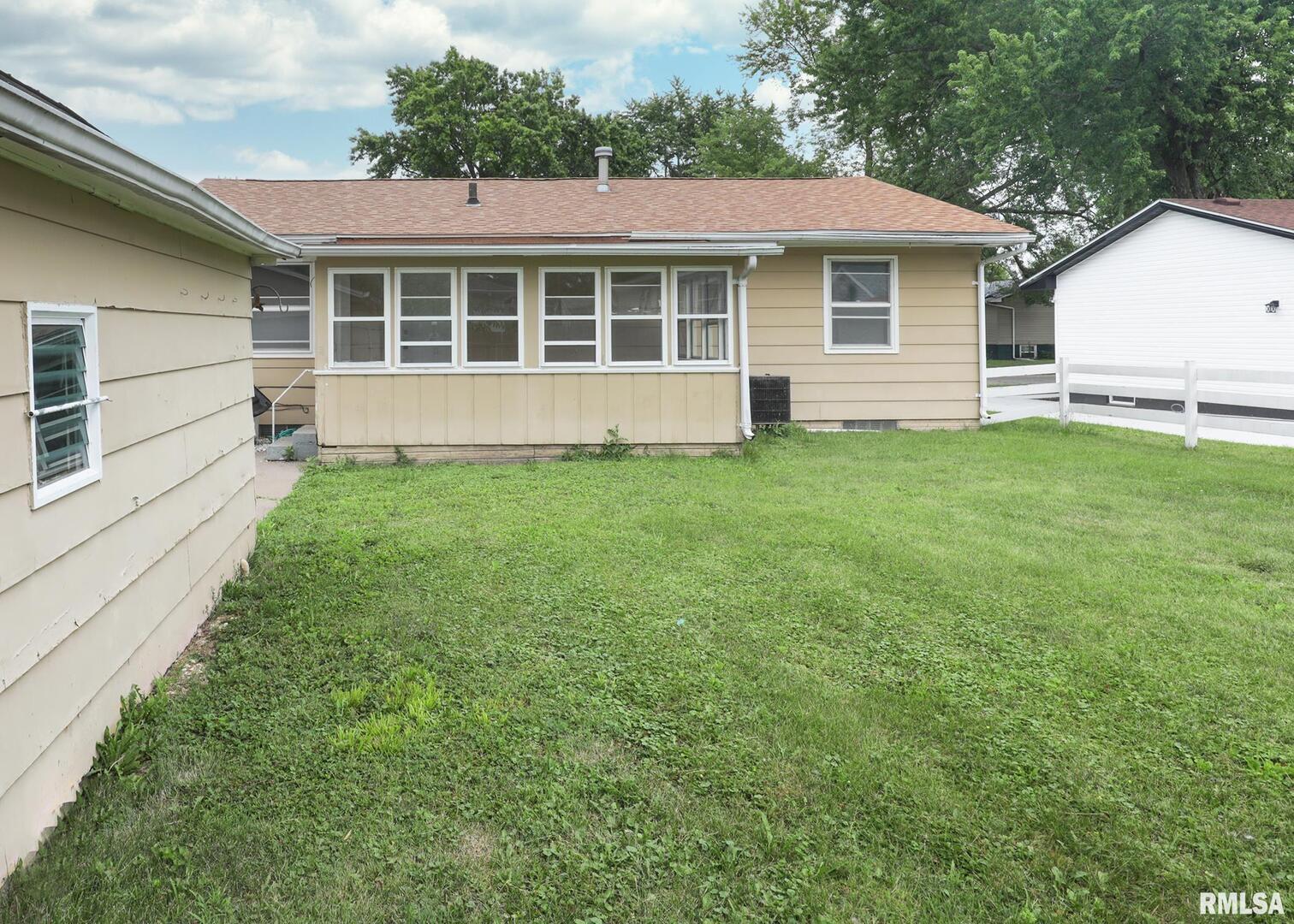 1310 Calvin Street Davenport, IA 52804 - Photo 3 of 39 a house view with a garden space