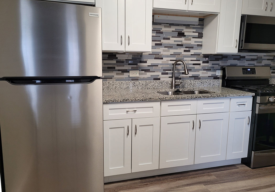 2820 Dundee Road, Unit 2B Northbrook, IL 60062 - Photo 3 of 16 a kitchen with stainless steel appliances white cabinets and a refrigerator