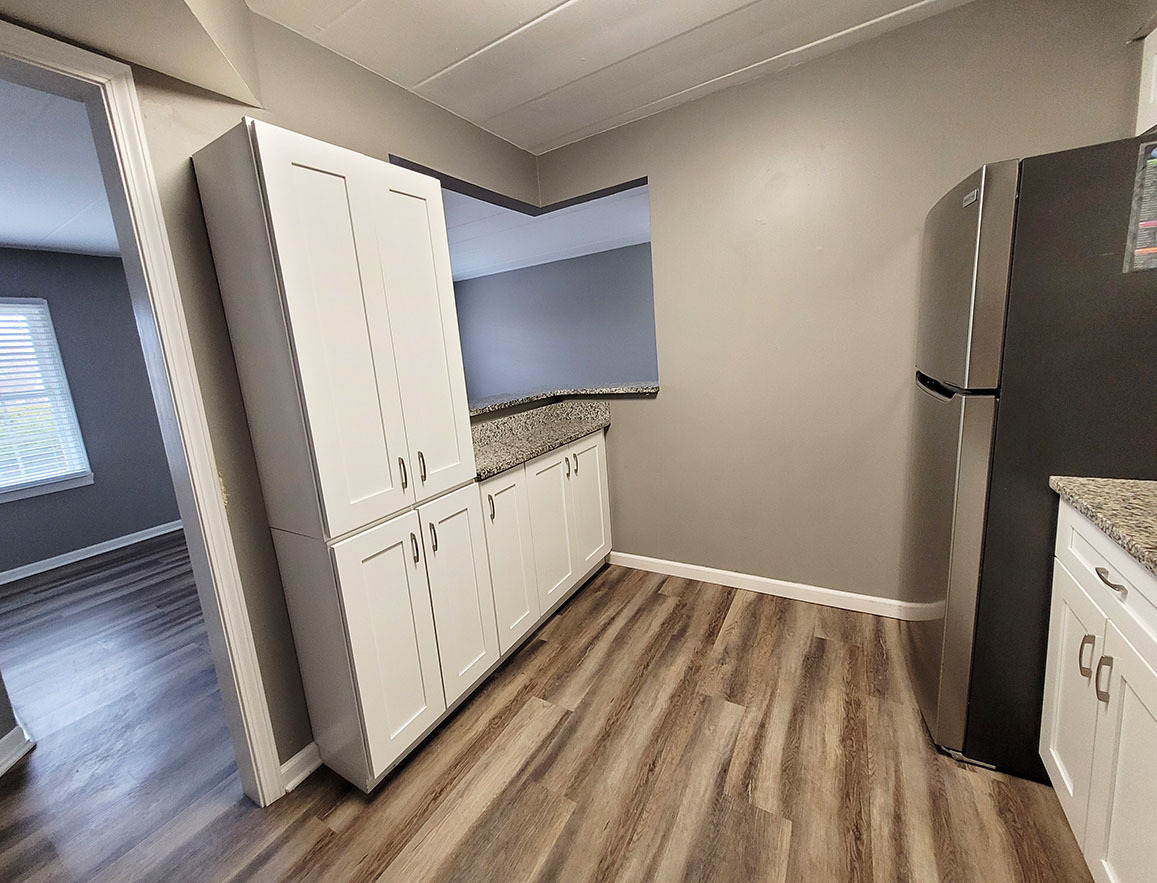 2820 Dundee Road, Unit 2B Northbrook, IL 60062 - Photo 4 of 16 a view of a kitchen with refrigerator and wooden floor