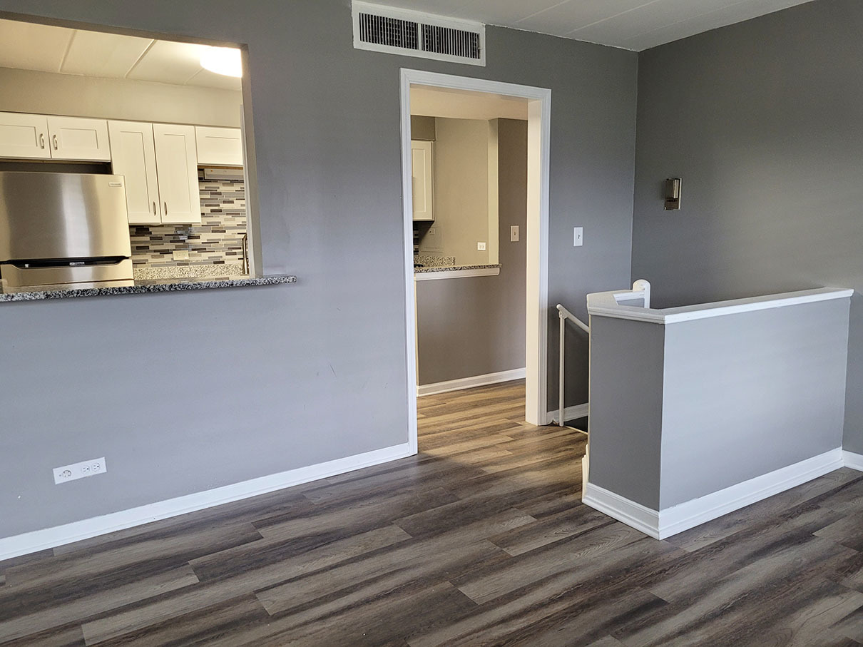 2820 Dundee Road, Unit 2B Northbrook, IL 60062 - Photo 5 of 16 a view of kitchen cabinets and wooden floor