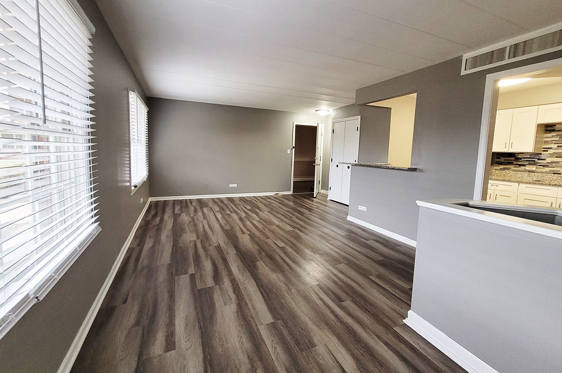 2820 Dundee Road, Unit 2B Northbrook, IL 60062 - Photo 6 of 16 a view of empty room with wooden floor and fan