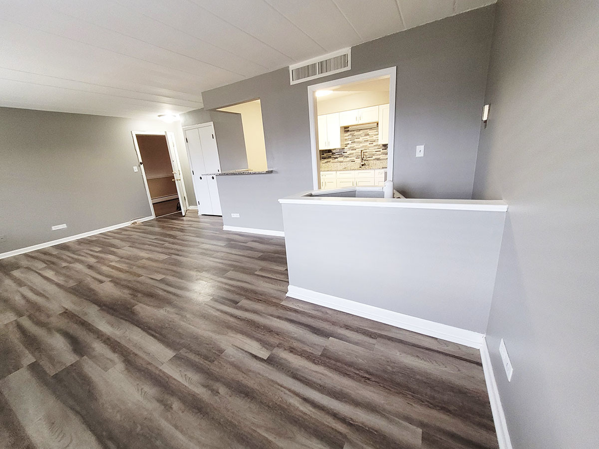 2820 Dundee Road, Unit 2B Northbrook, IL 60062 - Photo 7 of 16 a view of empty room with wooden floor and window