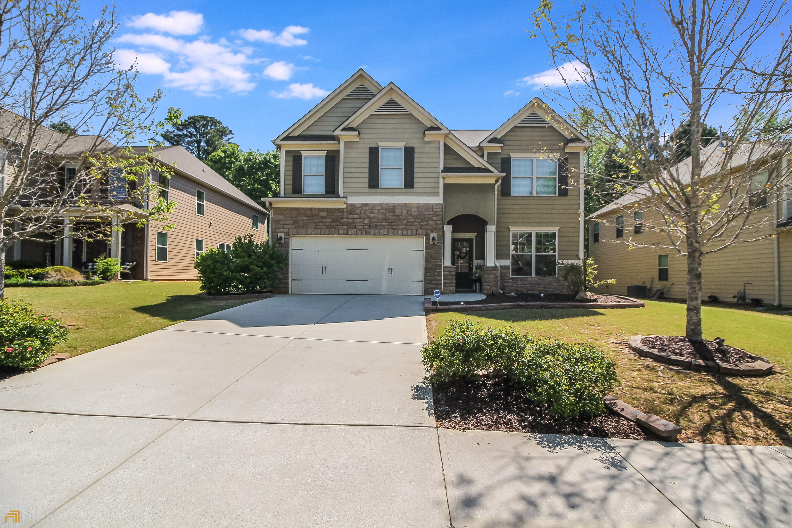 7561 Watson Circle Locust Grove, GA 30248 - Photo 1 of 1 a front view of a house with a yard