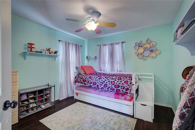 a bedroom with furniture and a chandelier