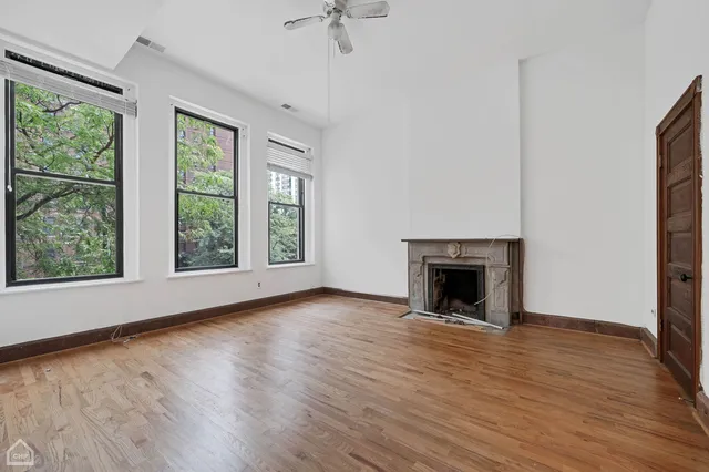 a bathroom with a tub a sink and mirror