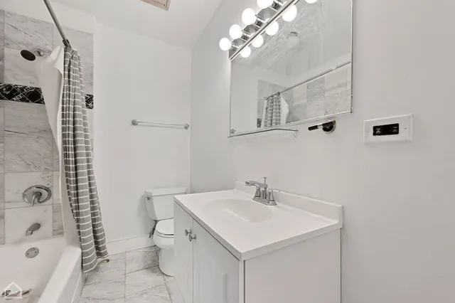 a bathroom with a bathtub a sink and a shower