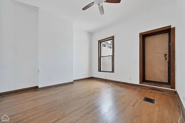 a bathroom with a toilet a sink a vanity and mirror