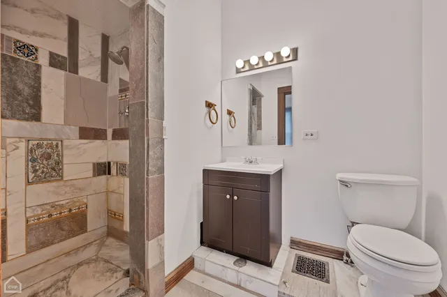 a kitchen with cabinets stainless steel appliances and a counter space