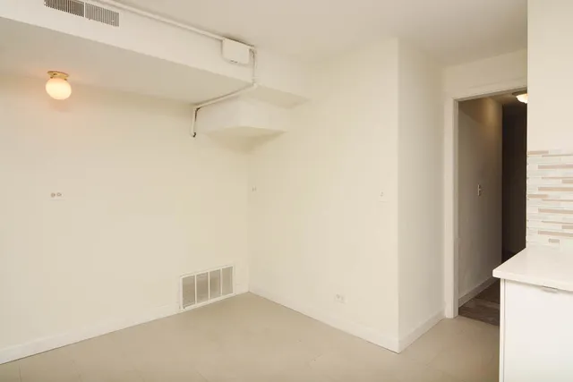 a view of a room with a hallway