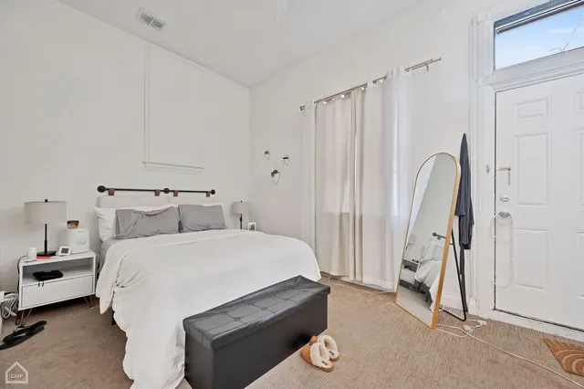 a bathroom with a sink vanity mirror and toilet