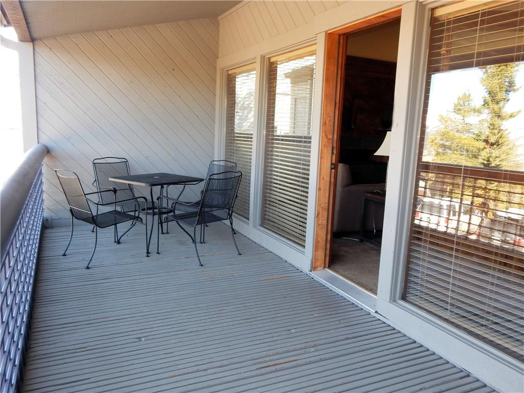 53 View Lane Road, Unit 4D Breckenridge, CO 80424 - Photo 3 of 23 a view of a dining room with furniture and wooden floor
