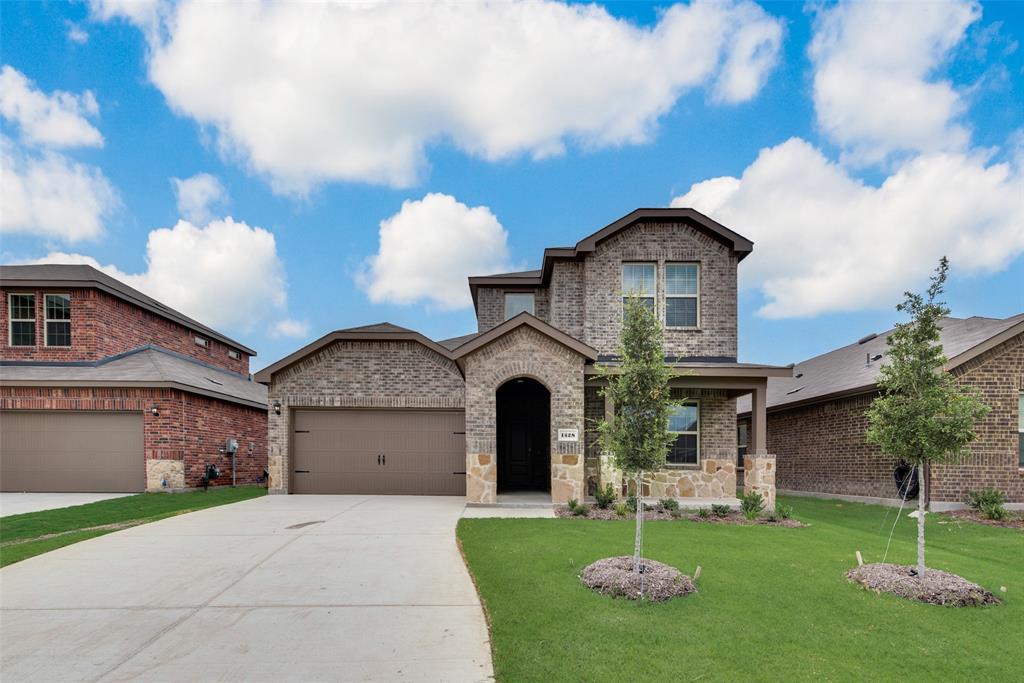 1428 Millstead Rill Drive Caddo Mills, TX 75135 - Photo 2 of 24 a front view of a house with garden