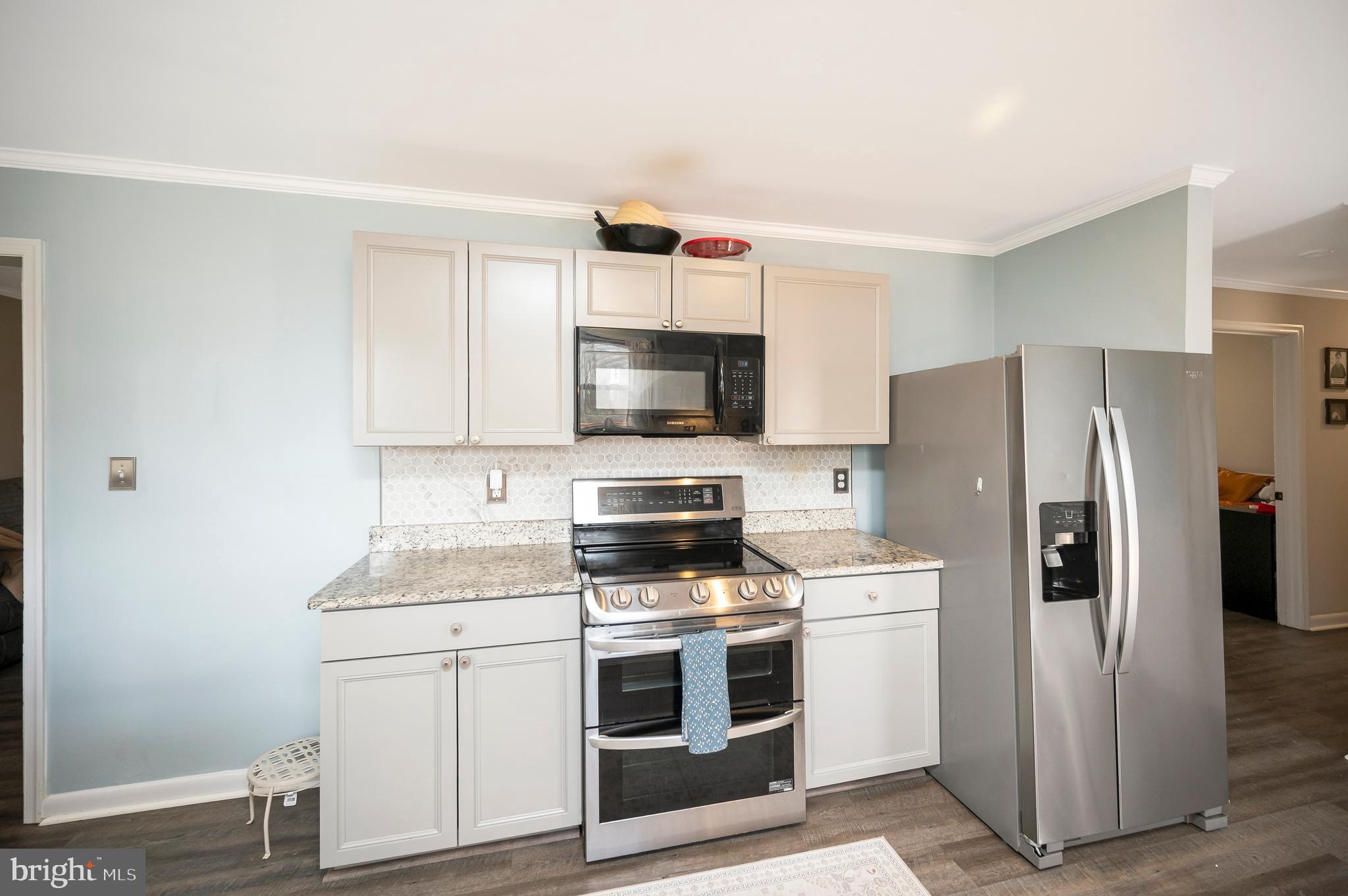 110 Doc Stone Road Stafford, VA 22556 - Photo 13 of 39 a kitchen with a white stove top oven and refrigerator