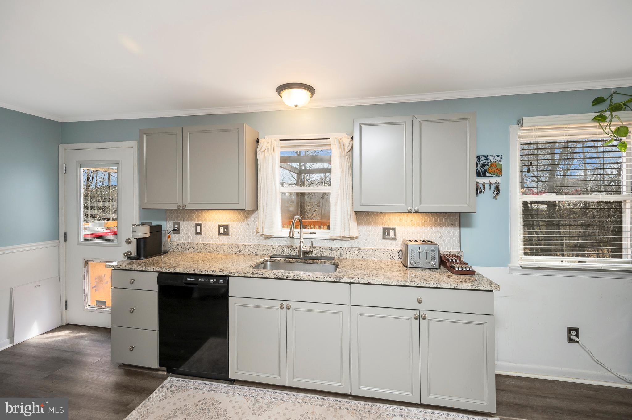 110 Doc Stone Road Stafford, VA 22556 - Photo 14 of 39 a kitchen with a sink stove and cabinets