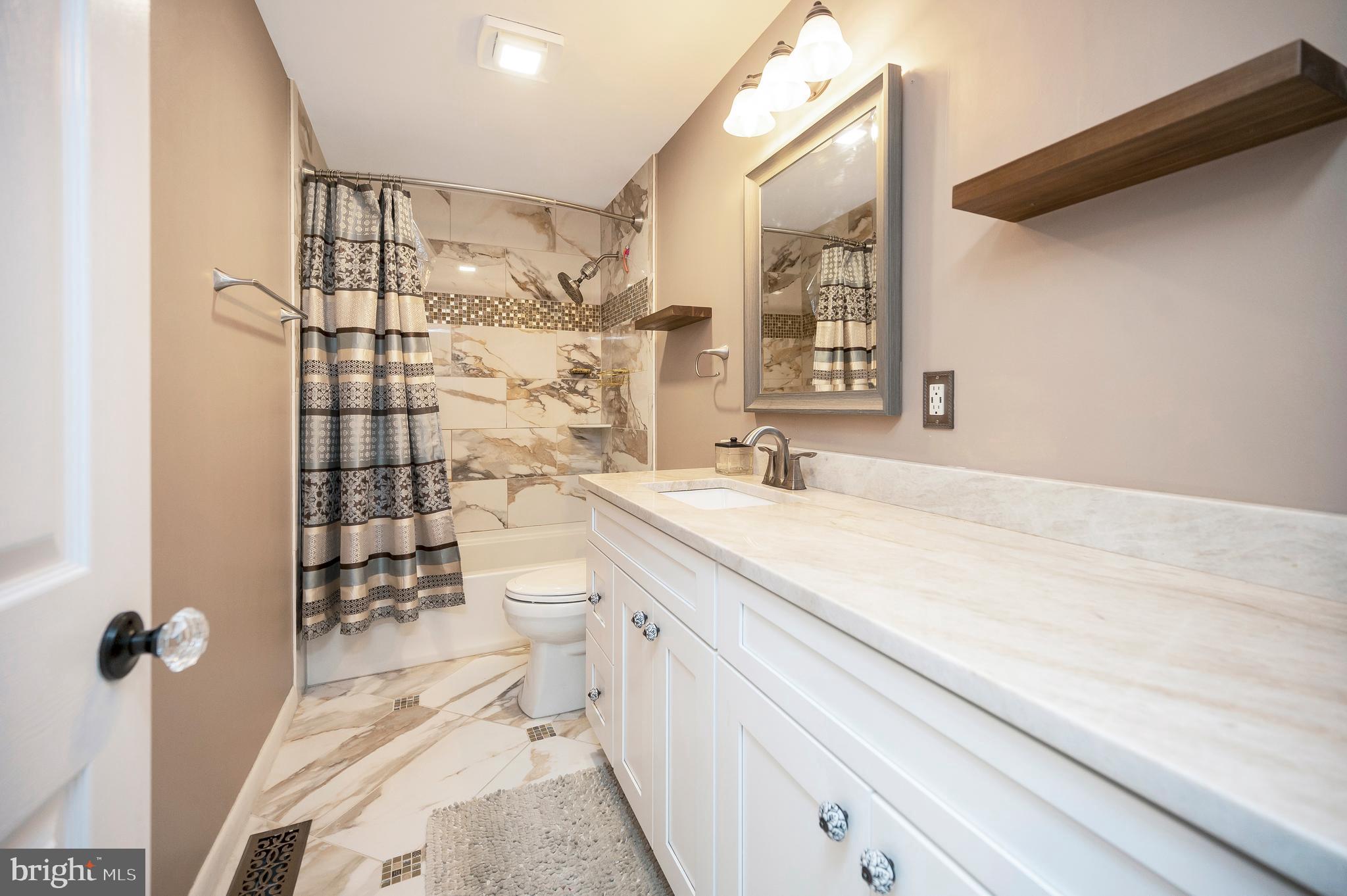 110 Doc Stone Road Stafford, VA 22556 - Photo 23 of 39 a bathroom with a sink a toilet and shower