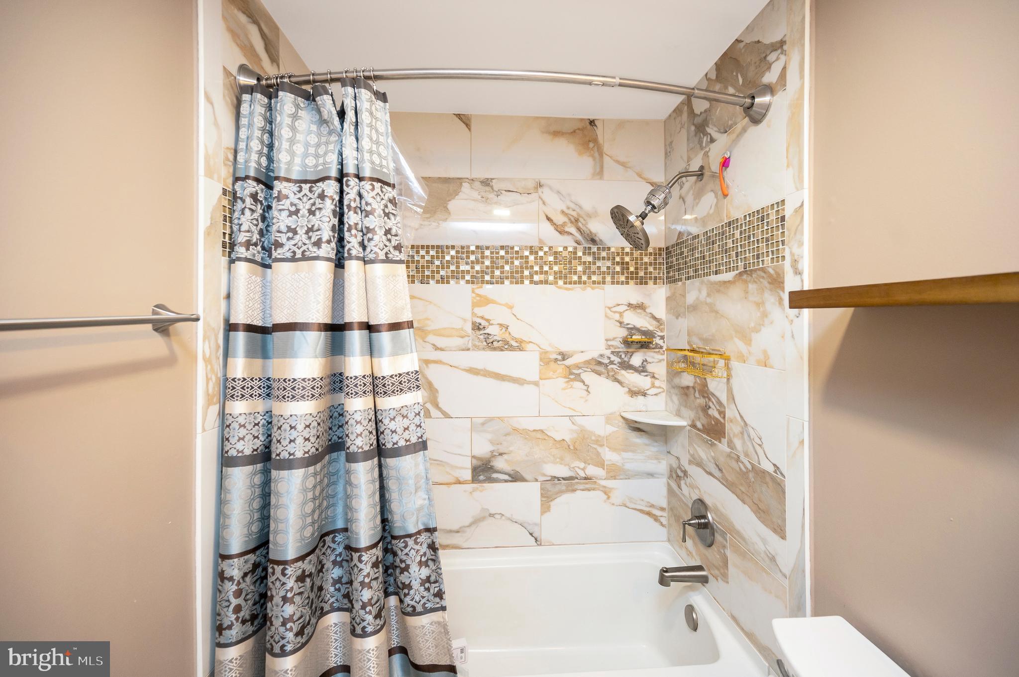 110 Doc Stone Road Stafford, VA 22556 - Photo 24 of 39 a bathroom with a bathtub and shower