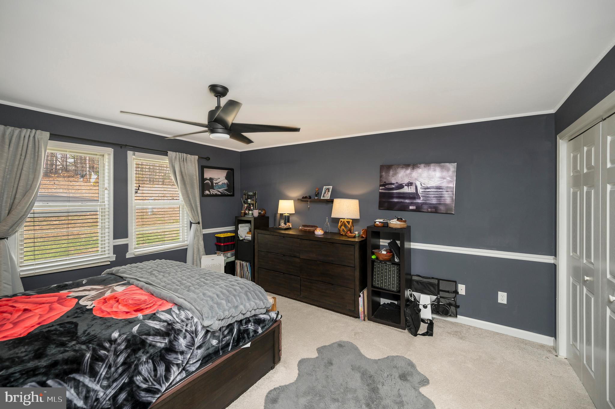 110 Doc Stone Road Stafford, VA 22556 - Photo 25 of 39 a bedroom with a bed and a chandelier