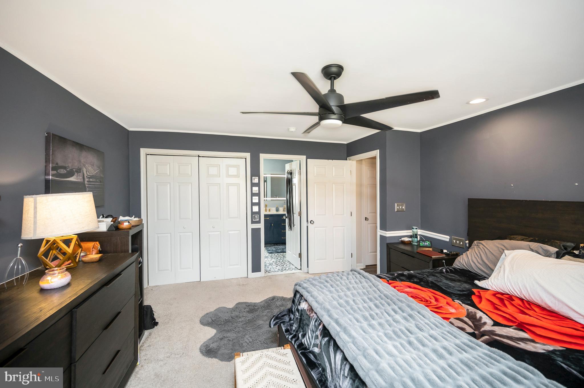 110 Doc Stone Road Stafford, VA 22556 - Photo 27 of 39 a bedroom with a bed and a chandelier