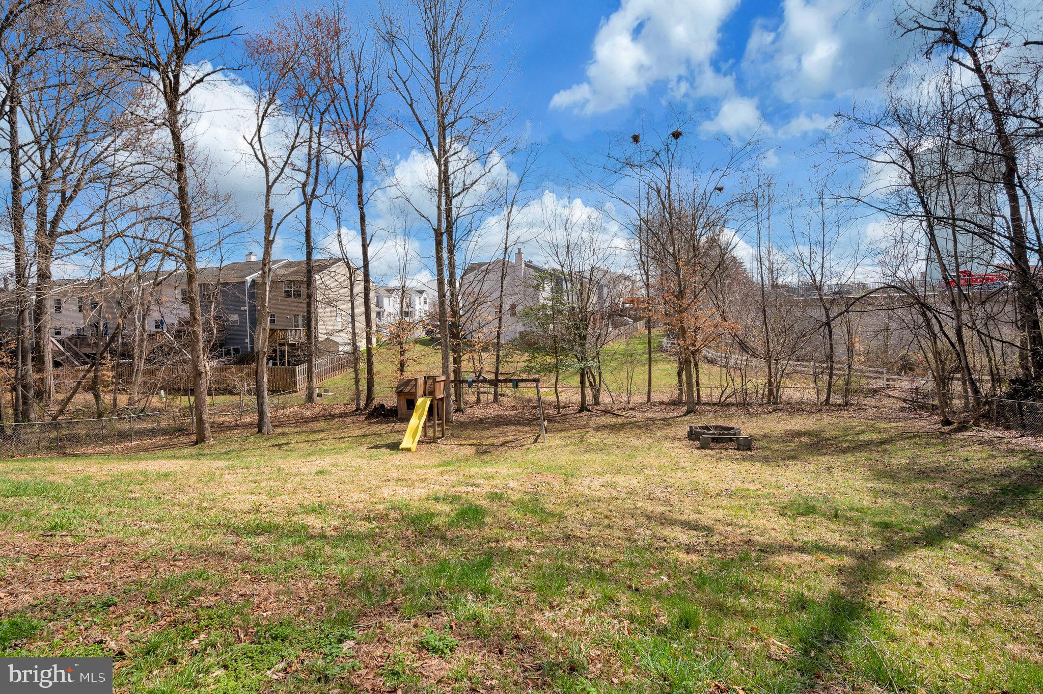 110 Doc Stone Road Stafford, VA 22556 - Photo 37 of 39 a view of yard with a building and trees in the background