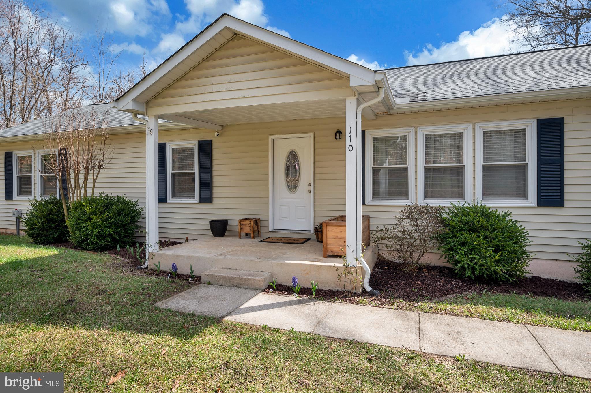 110 Doc Stone Road Stafford, VA 22556 - Photo 4 of 39 a front view of a house with a yard