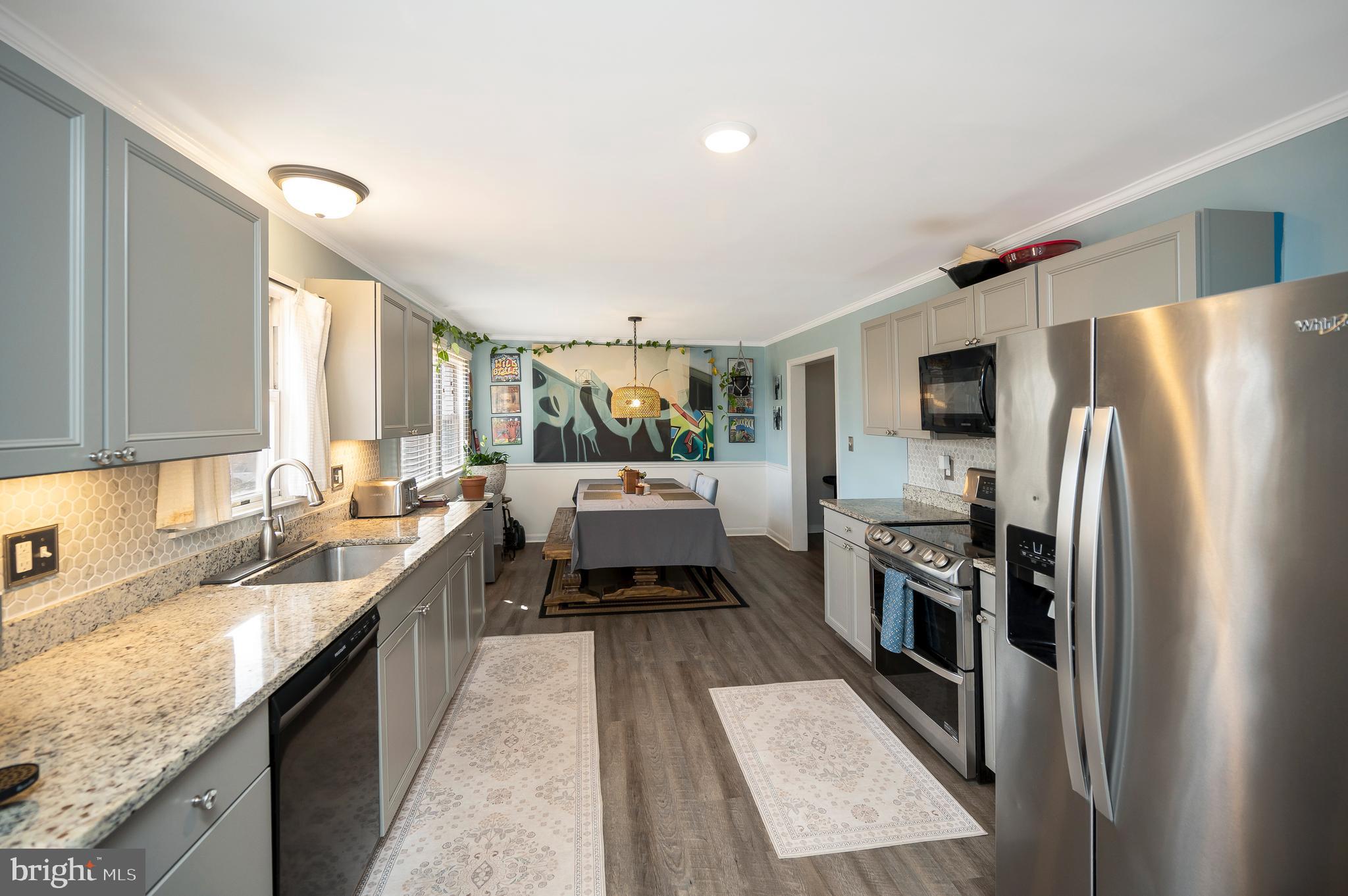110 Doc Stone Road Stafford, VA 22556 - Photo 10 of 39 a kitchen with a refrigerator sink and stove