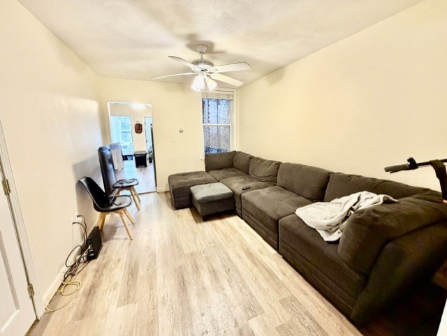 14 Cleveland Place, Unit 2 Boston, MA 02113 - Photo 9 of 18 a living room with furniture and a chandelier