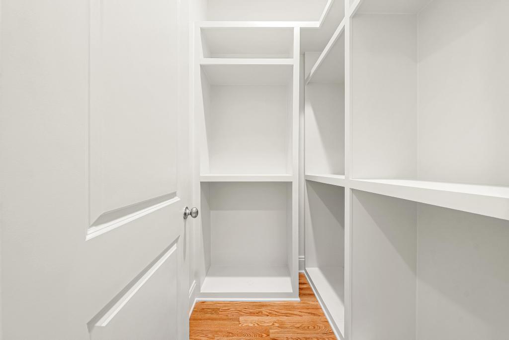 707 Vickery Street Extension Hartwell, GA 30643 - Photo 31 of 50 Smartly designed storage solutions with built-in shelving maximize this functional closet space.