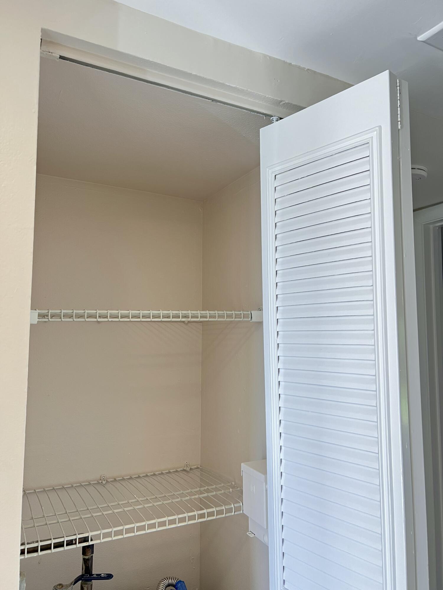 21890 Lake Forest Circle, Unit 101 Boca Raton, FL 33433 - Photo 13 of 55 Hall closet