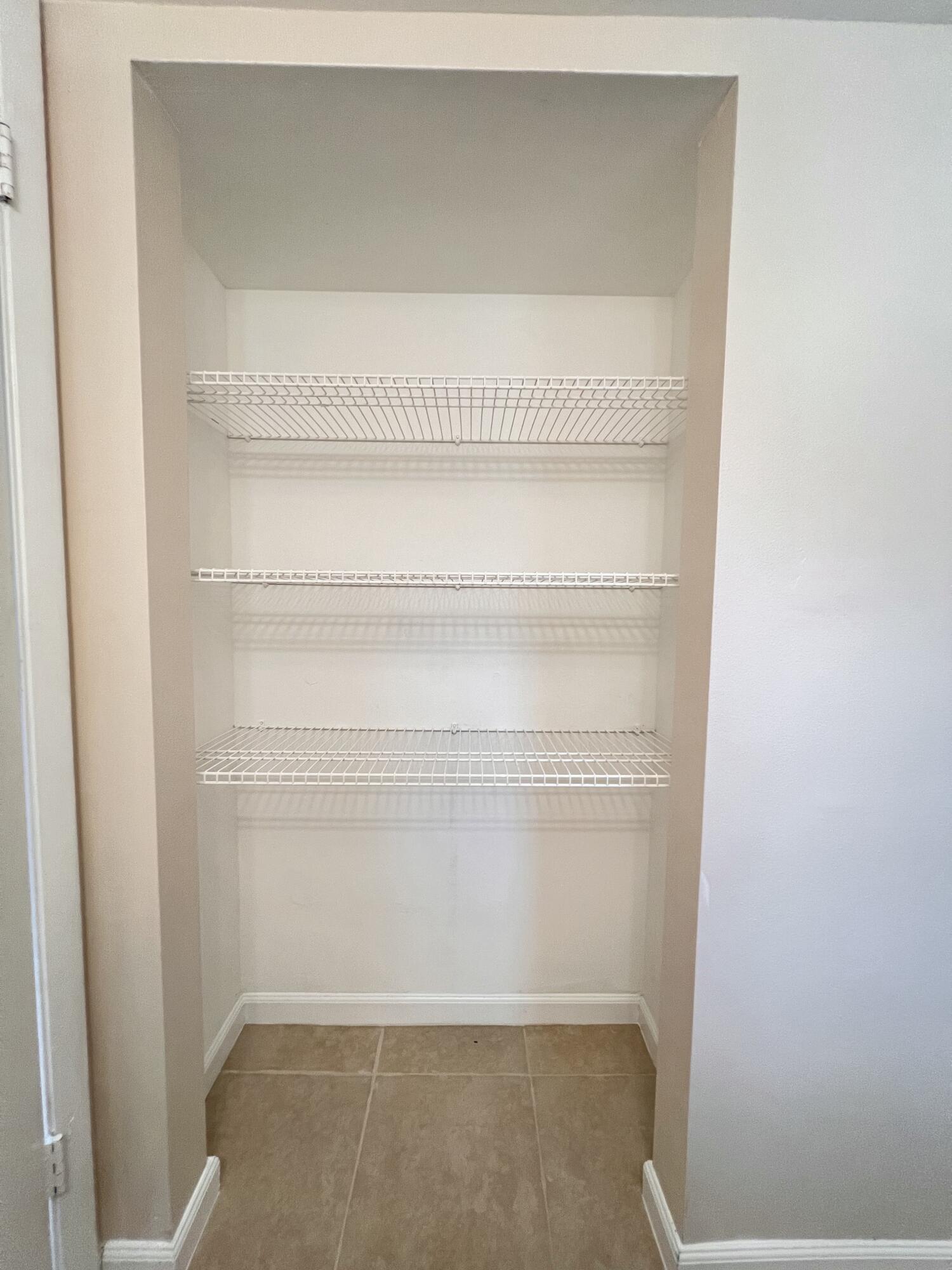 21890 Lake Forest Circle, Unit 101 Boca Raton, FL 33433 - Photo 33 of 55 Extra closet in bathroom