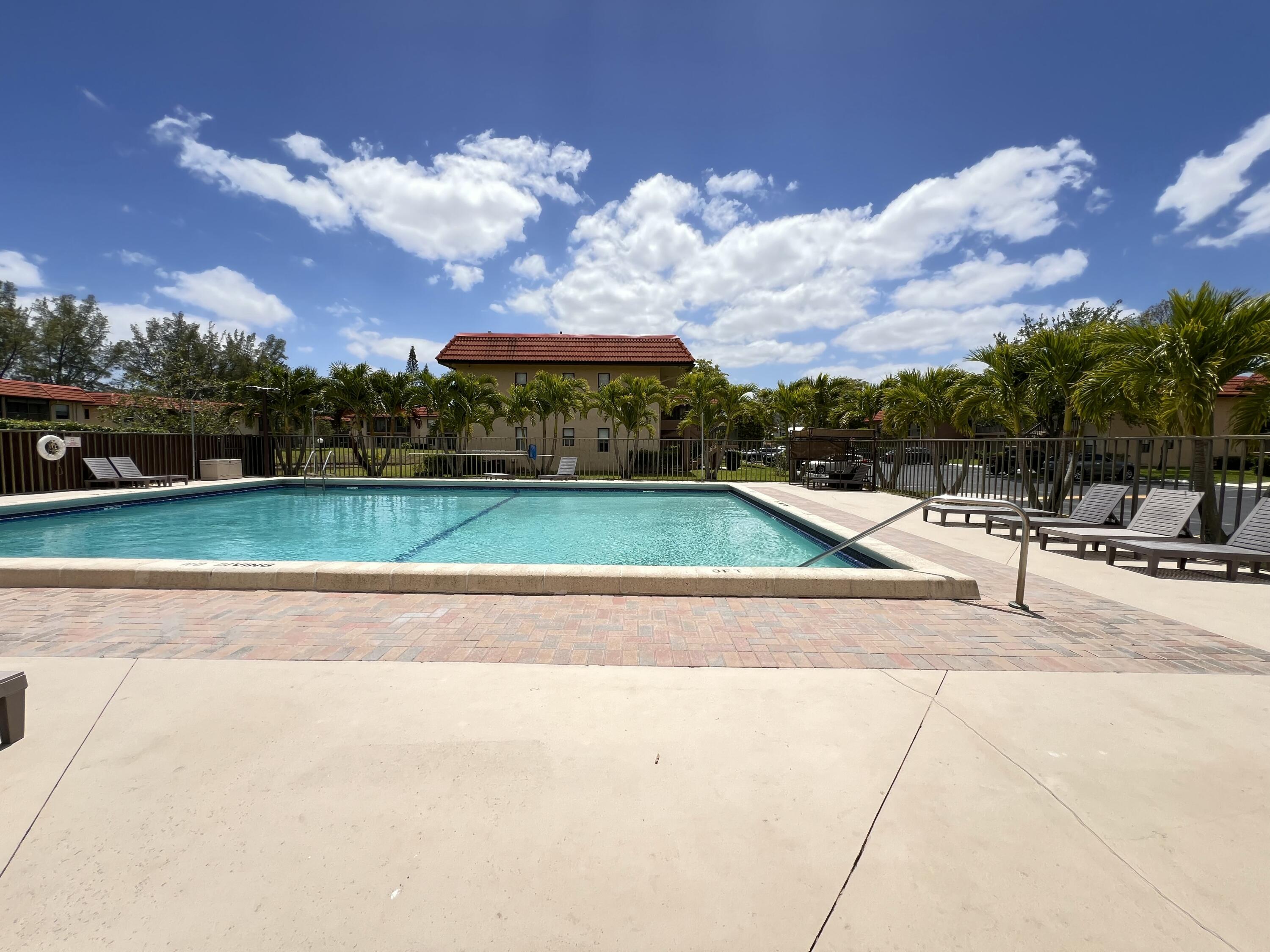 21890 Lake Forest Circle, Unit 101 Boca Raton, FL 33433 - Photo 42 of 55 Lounge at the pool