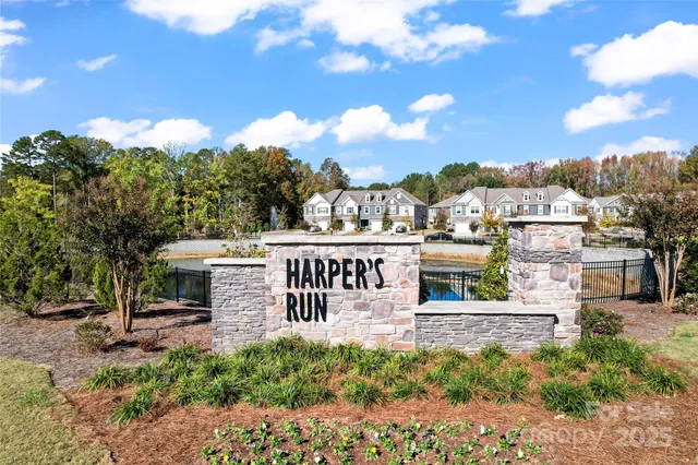 a view of a park with iron fence