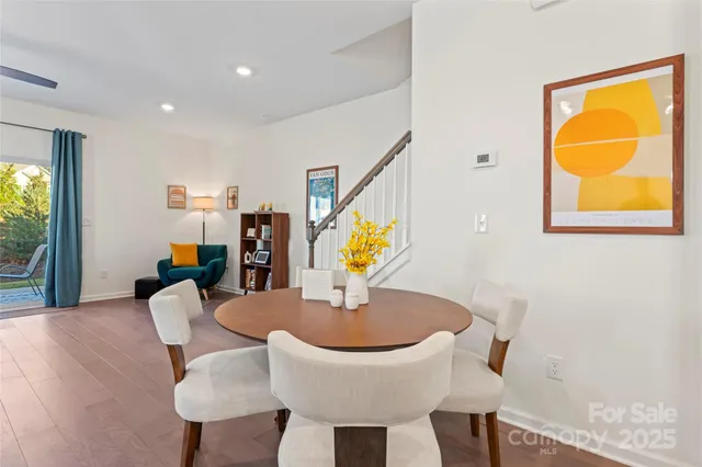 a bedroom with a bed a dresser and a window