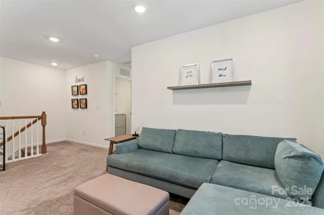 a bedroom with a bed and a mirror on dresser