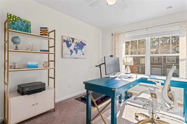 a view of a patio with table and chairs with wooden floor and fence
