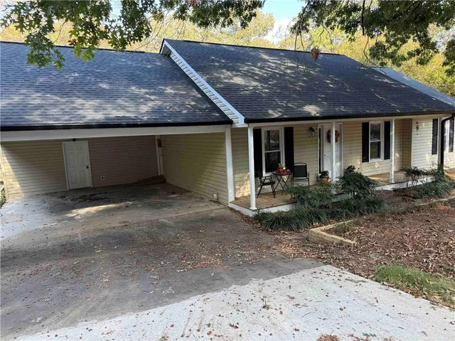 a front view of a house with garden